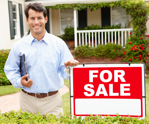 realtor and for sale sign