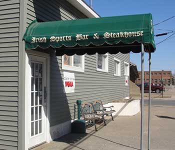 Grey building with green awning