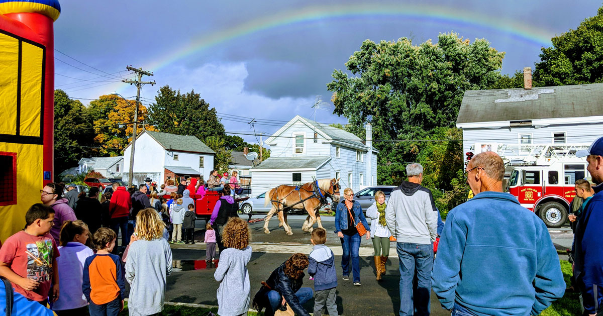 event crowd with a horse and rainbow