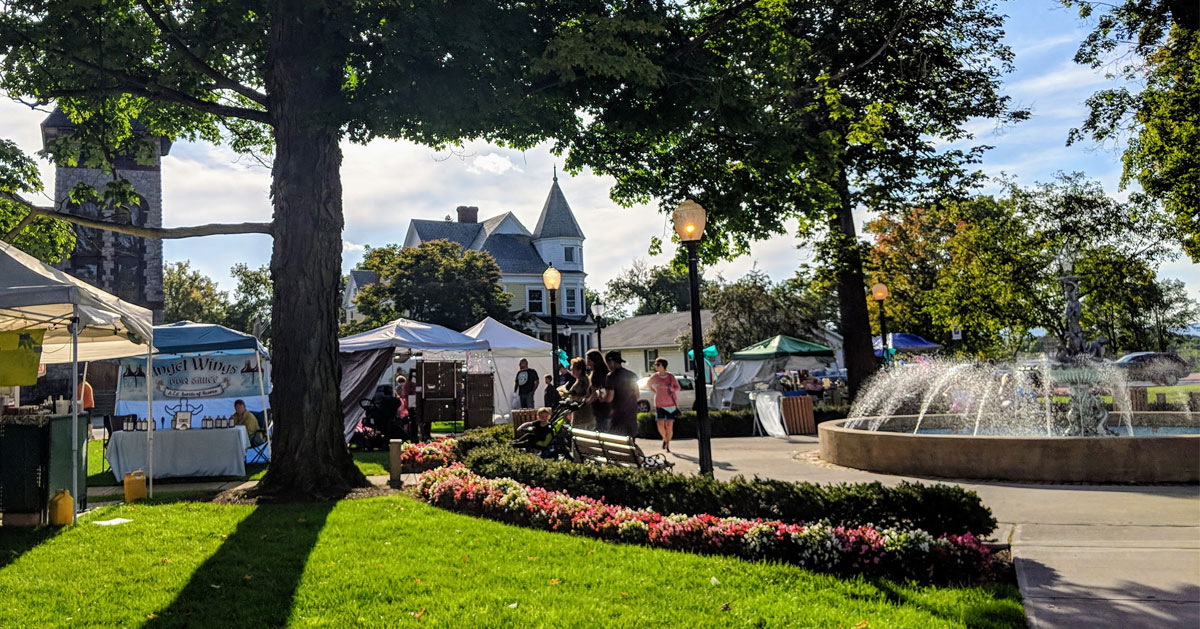 vendors set up in town square by fountain