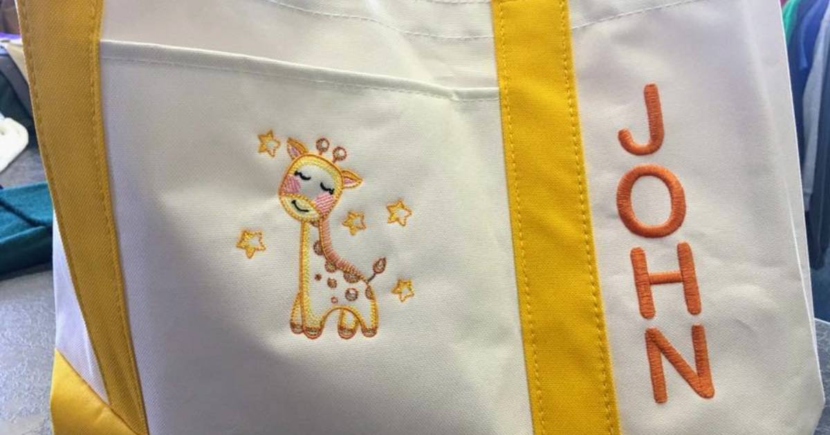 personalized baby bag with a giraffe and the name John