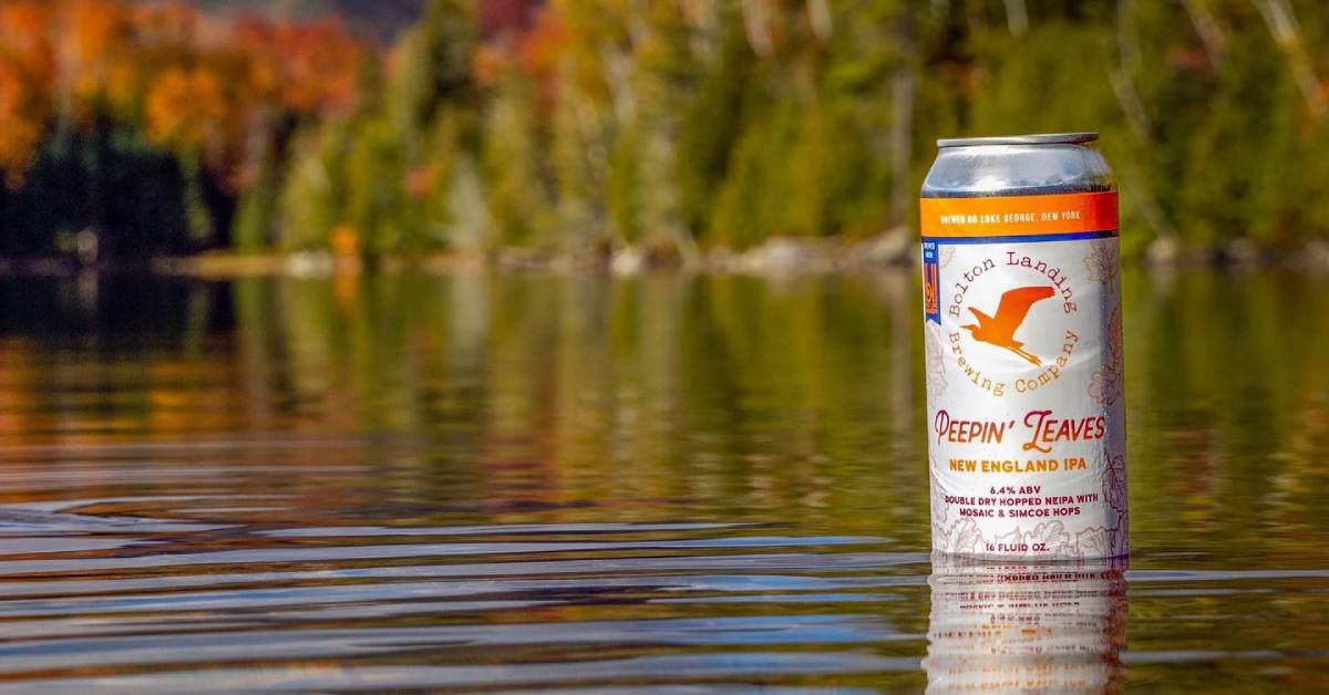 can of peepin leaves craft beer in a lake