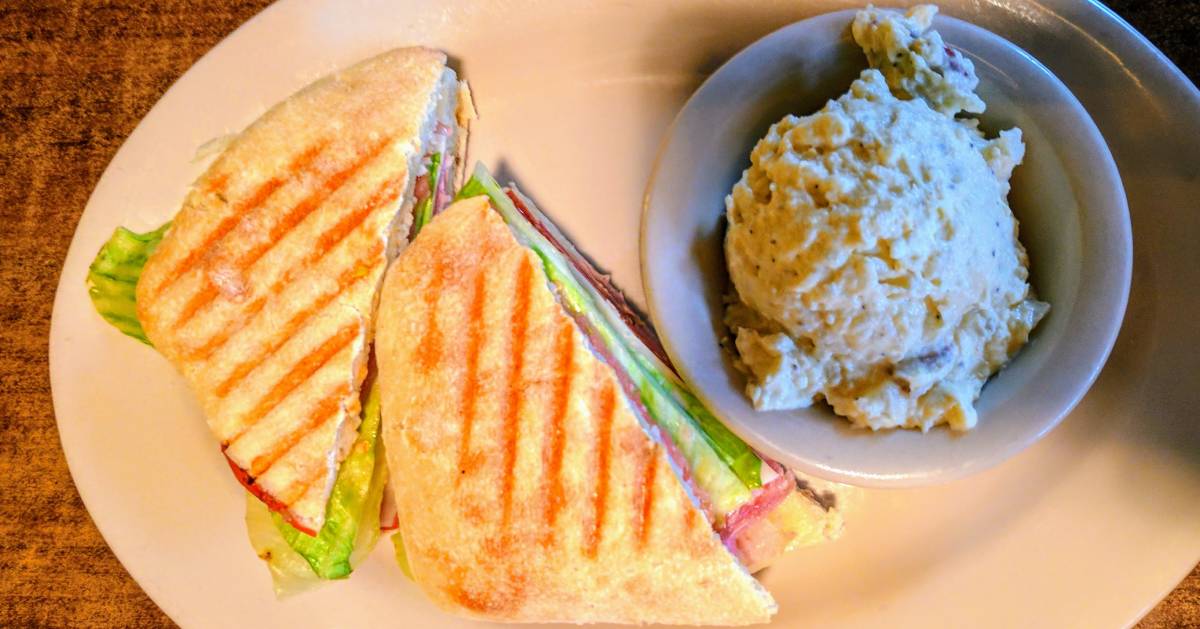 sandwich with potato salad on plate